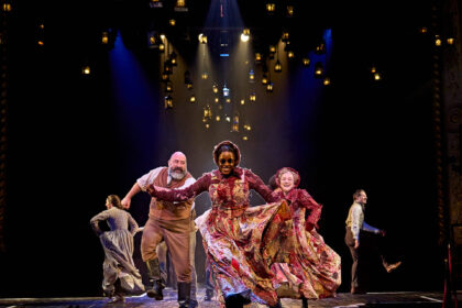 Frances McNamee as Belle, Alastair Parker as Fezziwig, Gemma Knight Jones as Ghost of Christmas Present, Julie Jupp as Ghost of Christmas Past and Samuel Townsend as Fred in A Christmas Carol at The Old Vic (2023)